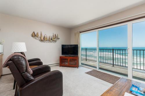 a living room with a view of the ocean at Ocean Terrace Condominiums in Lincoln City