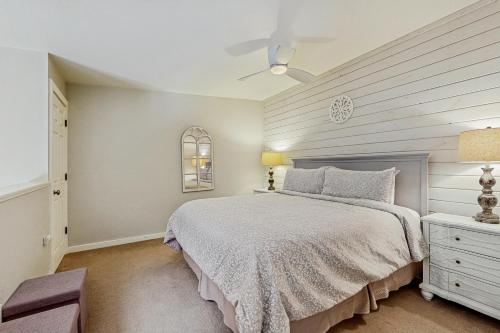 a bedroom with a bed and a white wall at Jarvis #301 in Durango