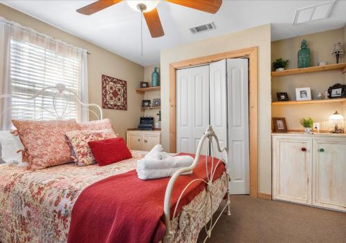 a bedroom with a bed and a ceiling fan at Barndominium with Farm and Firepit near Lake Georgetown in Georgetown