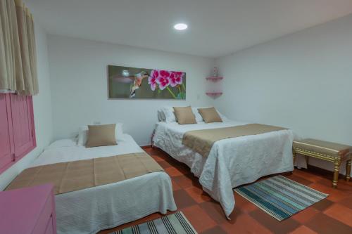 Postel nebo postele na pokoji v ubytování Hotel Balcón del Cielo