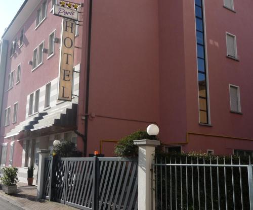 a building with a fence and a sign on it at Hotel Paris in Mestre