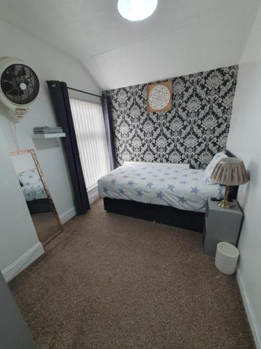 Ένα ή περισσότερα κρεβάτια σε δωμάτιο στο Private Room In Cardiff