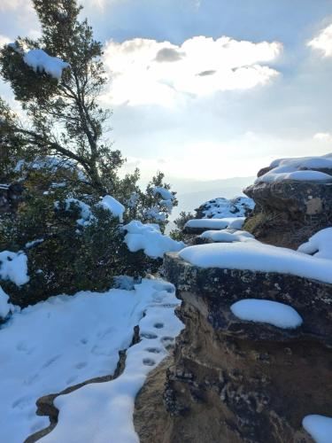 a river covered in snow on a mountain at B&B Poggio di Vento sulla via degli Dei in Monzuno