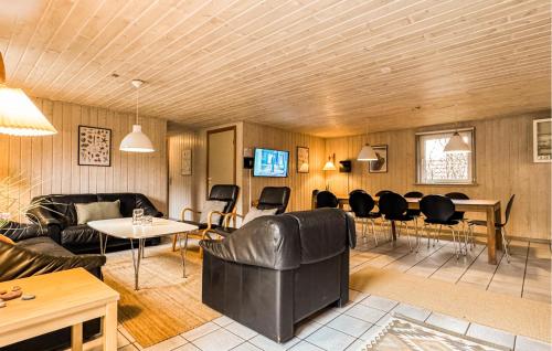 a living room with a couch and chairs and a table at Amazing Home In Ringkøbing With Kitchen in Søndervig