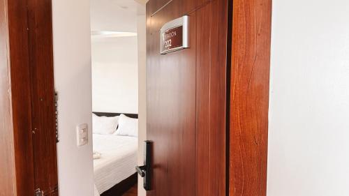Postel nebo postele na pokoji v ubytování SÁNCHEZ HOTEL & SPA By Chat Noir