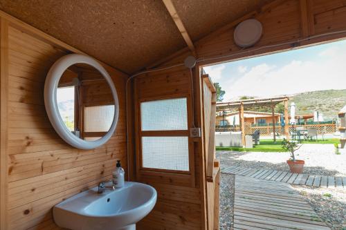 a bathroom with a sink and a mirror at Cortijo Pinar 2 in Níjar