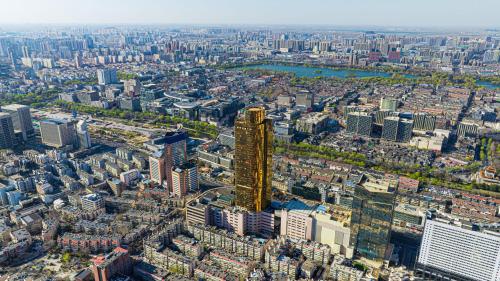 an aerial view of a city with tall buildings at Enlux Hotel in Jinan