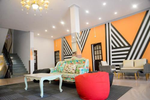 a living room with a couch and a table at Happy Bear Hostel Phu Quoc in Phu Quoc