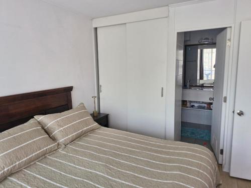Ένα ή περισσότερα κρεβάτια σε δωμάτιο στο Depto de 1 dorm con vista al mar