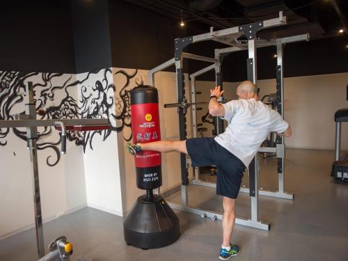a man doing a deadlift in a gym at Aya Niseko in Kutchan