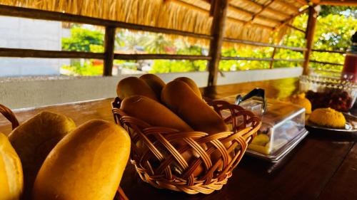 a basket of fruit sitting on top of a table at Pousada Maria do Lampião Jericoacoara- Antigo Jeri Vila Mini in Jericoacoara