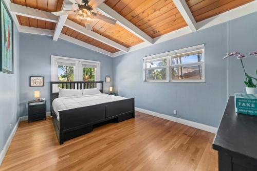 a bedroom with a bed and a wooden ceiling at Waterfront Gem , private boat dock , ocean access in Fort Lauderdale