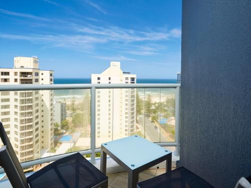 a balcony with a table and a view of the ocean at Twin beds room with a great view in Heart of GC in Gold Coast