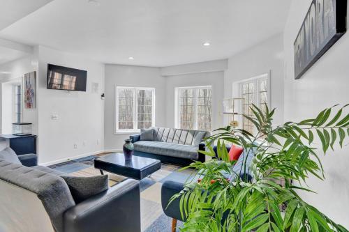 a living room with a couch and a table at Fancy Poconos Castle Indoor MEGA 10plus Hot Tub in East Stroudsburg