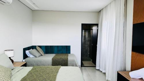 Ένα ή περισσότερα κρεβάτια σε δωμάτιο στο Pousada Casa Libertas