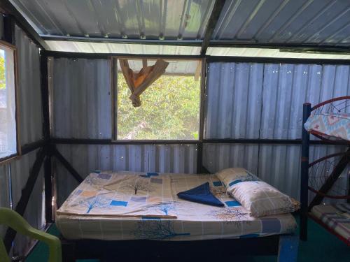 Postel nebo postele na pokoji v ubytování Hostal el peñón