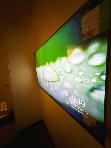 a television screen with a picture of water and bubbles at JFam Suites, C4-10R Studio, Up To 4 Pax in Biñan
