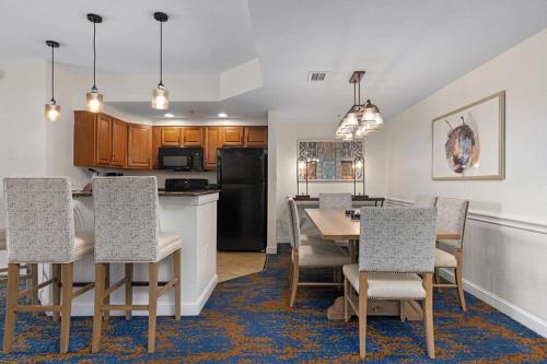 a kitchen and dining room with a table and chairs at Club Wyndham Bonnet Creek in Orlando