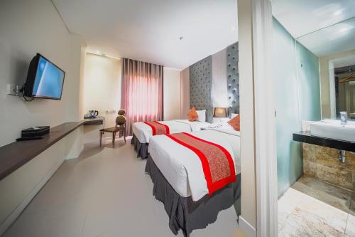 Katil atau katil-katil dalam bilik di Serela Cihampelas by KAGUM Hotels