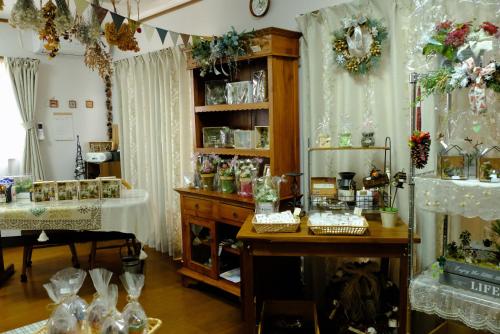 a room filled with lots of glass items on display at Minpaku-K in Nasushiobara