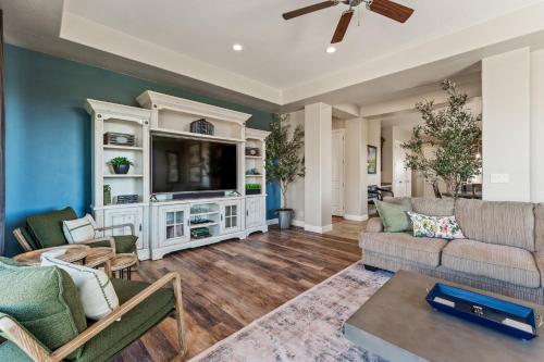 a living room with a couch and a tv at Sunset on the 5th in Washington