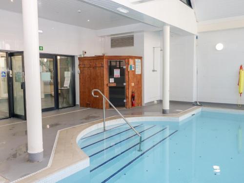 an empty swimming pool in a building at Cambrie in Tenby