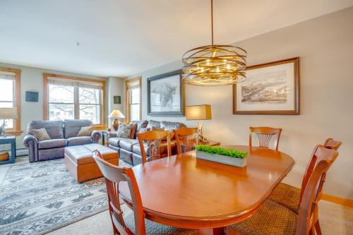 a dining room and living room with a table and chairs at Ski-InandOut Condo with Hot Tub Access in Keystone! in Keystone