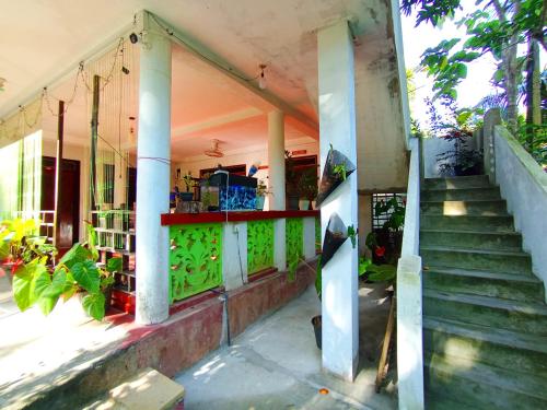 an outside view of a house with a staircase at Yokel View Villa in Weligama