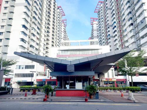 a large building with a large airplane on top of it at Koi Puchong 3 Room IOI Puchong Bkt Jalil Pavilion Stadium Sunway Pyramid Lagoon Hospital in Puchong