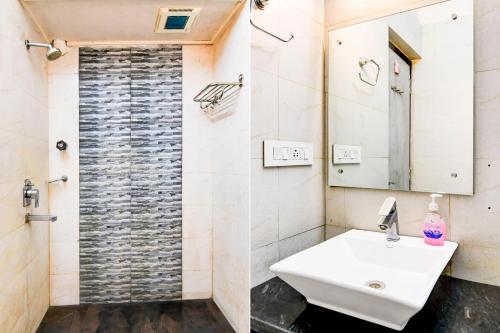 a bathroom with a sink and a shower at Super Collection O Behala in Kolkata