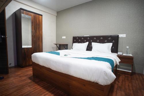 Ένα ή περισσότερα κρεβάτια σε δωμάτιο στο Nexus Corporate Stay