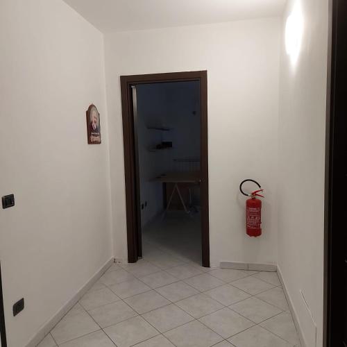 a hallway with a door and a table in a room at La Piccola Valle in Vallefiorita
