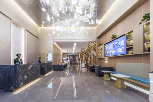 Μια τηλεόραση ή/και κέντρο ψυχαγωγίας στο Chengdu Happy Valley Jinfu Subway Station Wanxin Zhige Hotel