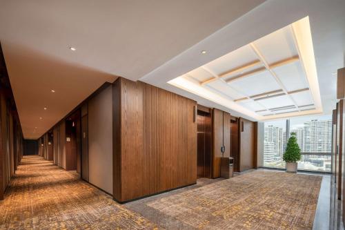 a hallway of an office building with a skylight at Hilton Garden Inn Suzhou Kunshan in Suzhou