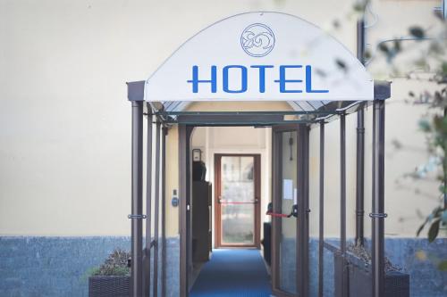 a hotel sign in front of a door at La Boheme SMART Hotel in Turin