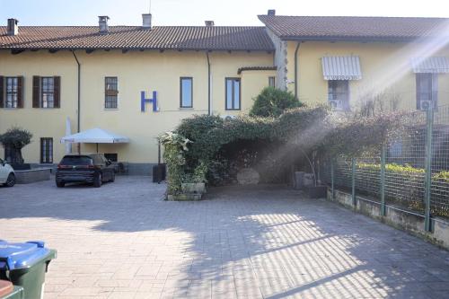 a house with a sprinkler in front of it at La Boheme SMART Hotel in Turin