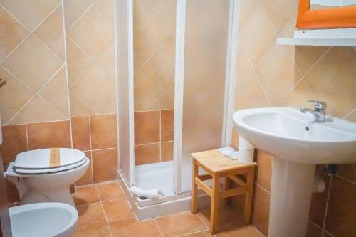 a bathroom with a toilet and a sink at La Boheme SMART Hotel in Turin