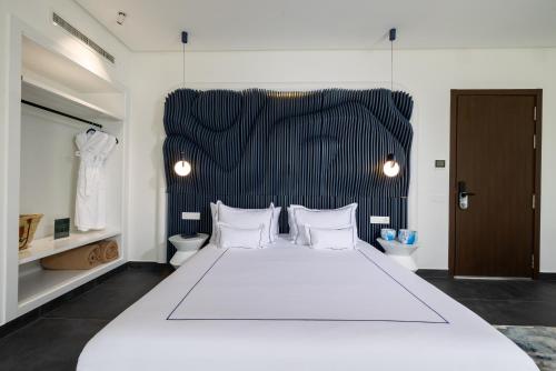 Ein Bett oder Betten in einem Zimmer der Unterkunft Yin Hotel & Spa