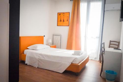 a bedroom with a bed and a large window at La Boheme SMART Hotel in Turin