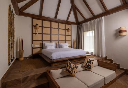 Ein Bett oder Betten in einem Zimmer der Unterkunft Yin Hotel & Spa