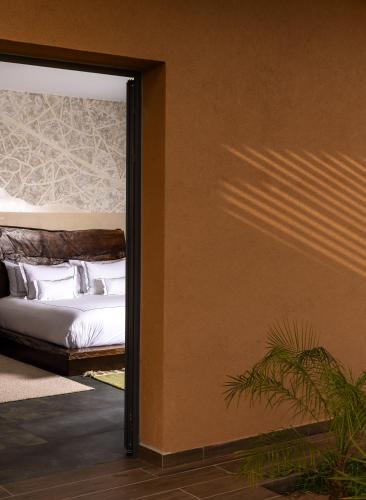 Ein Bett oder Betten in einem Zimmer der Unterkunft Yin Hotel & Spa