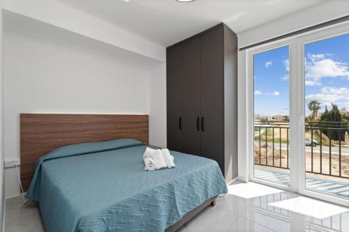 Ένα ή περισσότερα κρεβάτια σε δωμάτιο στο Modern 2BR Apartment Near Ayia Napa - Anastasia 101