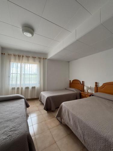 Postel nebo postele na pokoji v ubytování Pensio l'Avi Pep