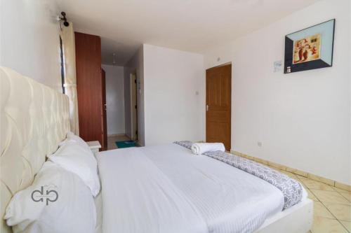Katil atau katil-katil dalam bilik di Milimani 3BR By Skyline Villa