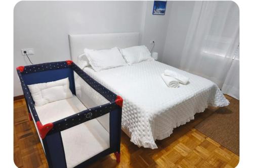 Ένα ή περισσότερα κρεβάτια σε δωμάτιο στο Casa Mamina