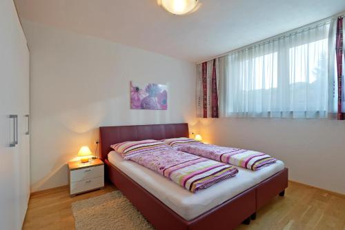 Postel nebo postele na pokoji v ubytování Alpenchalets Wilder Kaiser