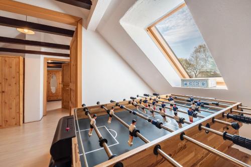 a gym with a gym ball court in a room with a window at Dat Haddehuus in Wangerland