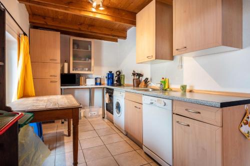 a kitchen with a sink and a dishwasher at Dat Haddehuus in Wangerland