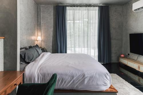 TV a/nebo společenská místnost v ubytování ฟาร์มดั๊กรีสอร์ท Farm Duck Resort