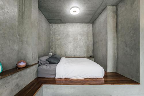 Postel nebo postele na pokoji v ubytování ฟาร์มดั๊กรีสอร์ท Farm Duck Resort